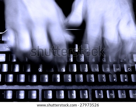 Business man typing on a computer keyboard