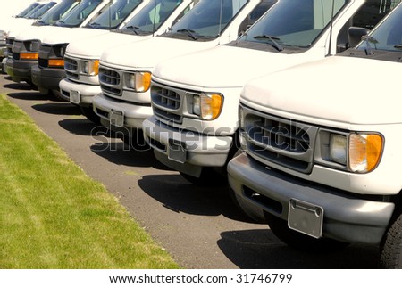 stock photo White cars in a row in a parking lot or car lot