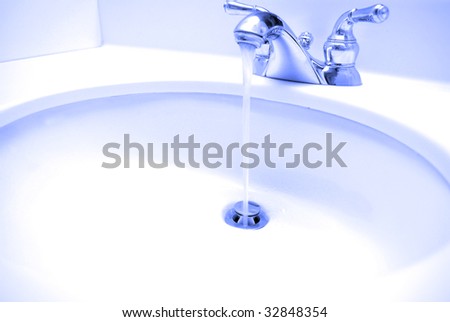 Water coming out of spout in bathroom sink and going down the drain