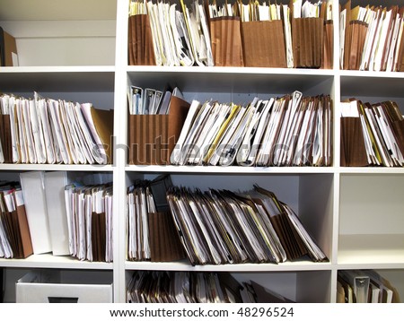Office shelves full of files and boxes