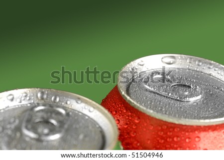 Closeup of soda or pop cans with drops of water for fresshness