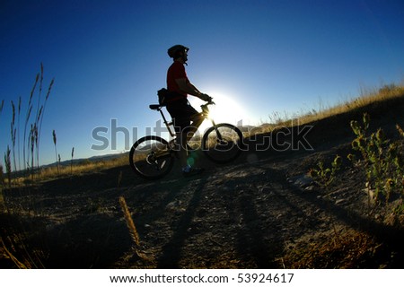 Mountain biking up a trail in the mountains