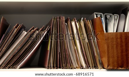 Office shelf full of business files
