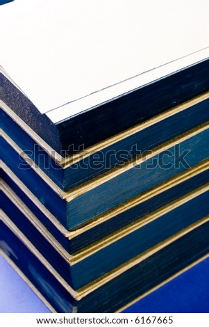 Old book collection with the front of its pages tinted of blue