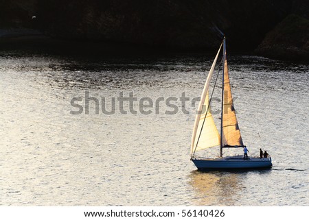 small boat sailing in the estuary of Eo, the border between Galicia and Asturias, northwestern Spain