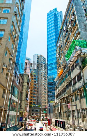 HONG KONG - JULY 30: Street view on downtown street on July 30, 2012 in Hong Kong. With a land mass of 1,104 km and 7 million people, Hong Kong is one of the most populated areas in the world