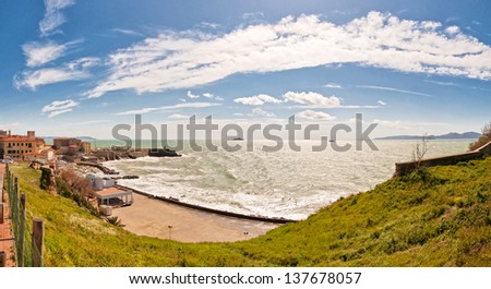panoramic wide view of sea, coastline and Piombino town, Tuscany - Italy