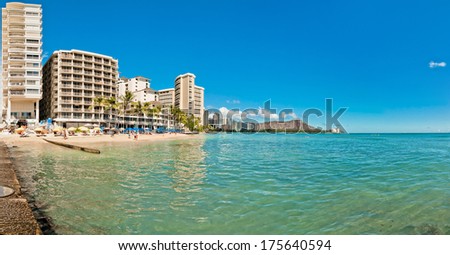 WAIKIKI, HAWAII - SEPTEMBER 7, 2013: Waikiki shoreline with hotels and Diamond Head in Honolulu, Hawaii. Waikiki white sand beach shoreline is Hawaii\'s most famous beach.