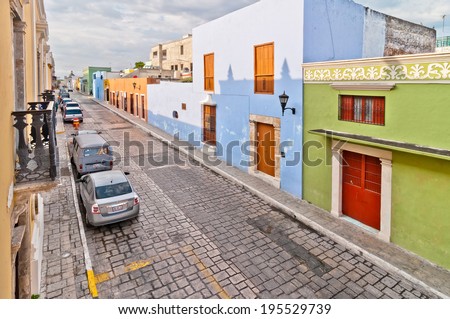 CAMPECHE, MEXICO - APRIL 19, 2014: downtown street with typical colonial buildings in Campeche, Mexico. The city was founded in 1540 by Spanish conquistadores atop pre-existing Maya city of Canpech