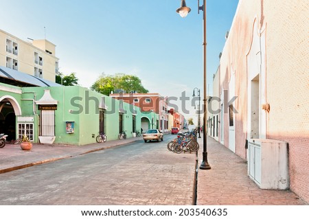 VALLADOLID, MEXICO - APRIL 21, 2014: downtown street view with typical colonial buildings in Valladolid, Mexico. The city was established in 1543 and named after the capital of Spain, at that time.