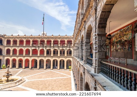 MEXICO CITY, MEXICO - APRIL 29, 2014: tourists visit National Palace in Mexico City, Mexico. The building is located on Mexico City\'s main square, the Plaza de la Constitucion (El Zocalo).