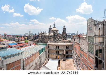 MEXICO CITY, MEXICO - APRIL 29, 2014: day view of Zocalo downtown with Catedral Metropolitana belfries in Mexico City, Mexico. The city is located at an altitude of 2,240 meters.