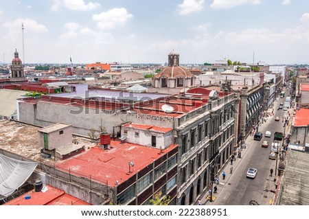 MEXICO CITY, MEXICO - APRIL 29, 2014: day view of Zocalo downtown with Catedral Metropolitana belfries in Mexico City, Mexico. The city is located at an altitude of 2,240 meters.