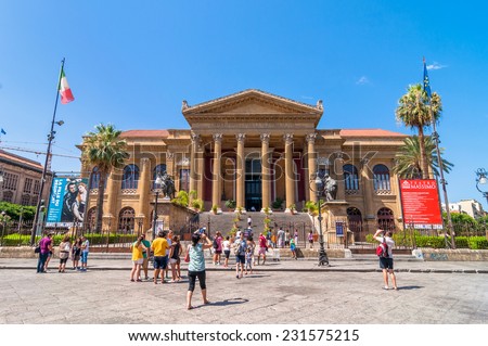 PALERMO, ITALY - AUGUST 16, 2014: tourists in front of famous opera house Teatro Massimo in Palermo, Sicily, Italy. It is the biggest in Italy, and one of the largest of Europe.