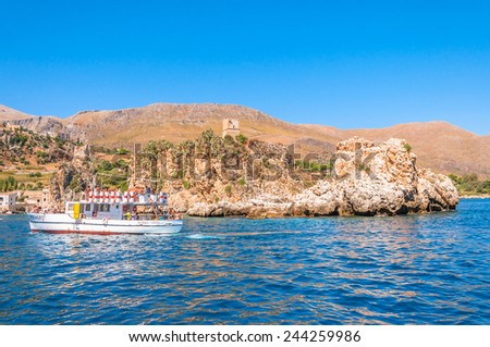 ZINGARO NATURAL RESERVE, ITALY - AUGUST 26, 2014: tourists enjoy blue mediterranean sea in Zingaro Natural Reserve, Italy. This National Park stretches along about 7 kilometers of unspoilt coastline