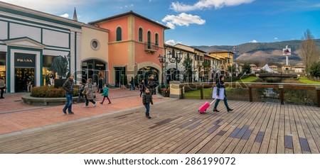BARBERINO DI MUGELLO, ITALY - January 24, 2015: tourists shop at McArthurGlen Designer Outlet in Barberino di Mugello, Italy. Designer Outlets are located across Europe and offer discounts