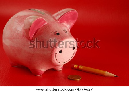 Pink piggy bank on red background