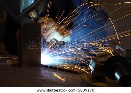 Busy welder in the middle of his job