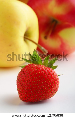 Strawberry with apples in background
