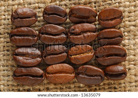 Coffee beans and coffee bean bag as background