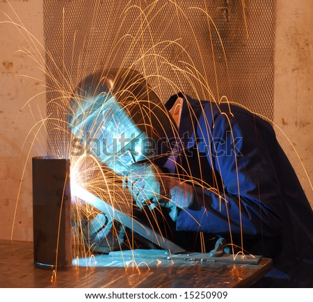 Factory welder doing his hard job