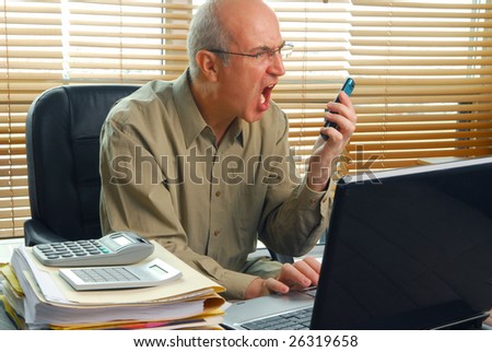 Angry businessman shouting after disappointing news was received over the phone