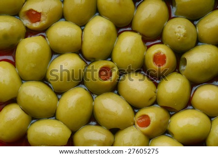 Background image of stuffed green olives, very close