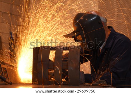 A worker is busy working on his new welding project