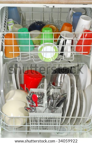 Dishwasher full of clean dishes after washing them