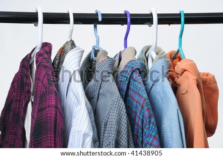 Clothing hung on hangers in a closet