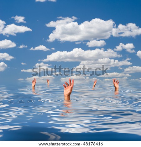 The hands of a drowning people sticking out of water