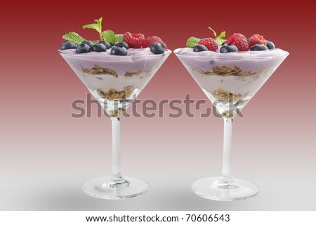 Extreme close-up image of fruit yogurt and cereal on white background
