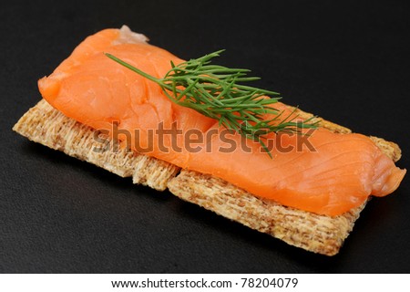 Close-up of smoked salmon served with crackers