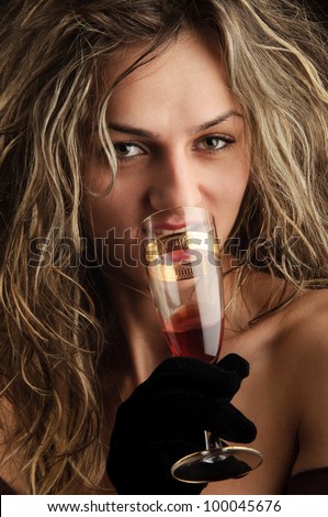 luxurious attractive blonde girl with champagne glass, gloves and white gold jewelry