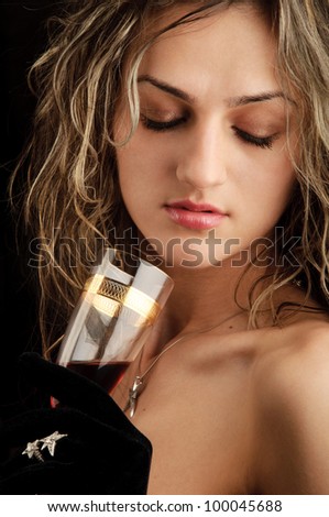 luxurious attractive blonde girl with champagne glass, gloves and white gold jewelry