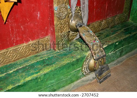 Buddhist monastery locked door decorated with turquoise and gems
