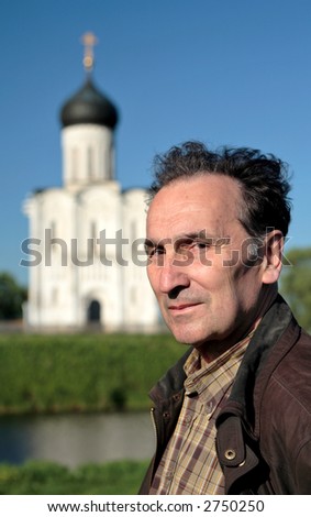 Man and religion. Man in front of the christian church