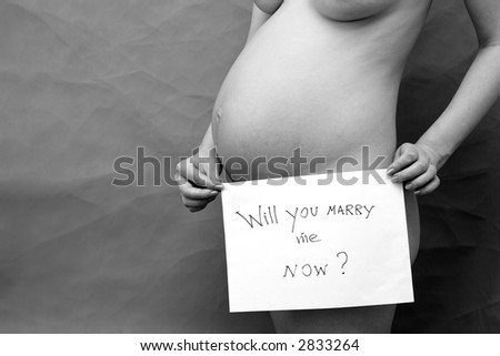 Pregnant woman holding tablet with question: “Will you marry me now ?”