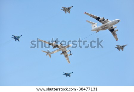 MOSCOW - MAY 9: Russian Air Force (four-engine aerial refueling tanker Il-76 and attack aircrafts Su-24 conducting aerial refueling) at Parade devoted to anniversary of Victory in the WW II held in Moscow, Russia on May 9, 2009.
