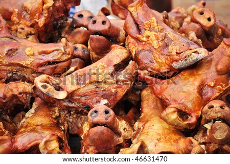 Grilled pig heads at ecuadorian farm market(can be used as illustration about swine flu)