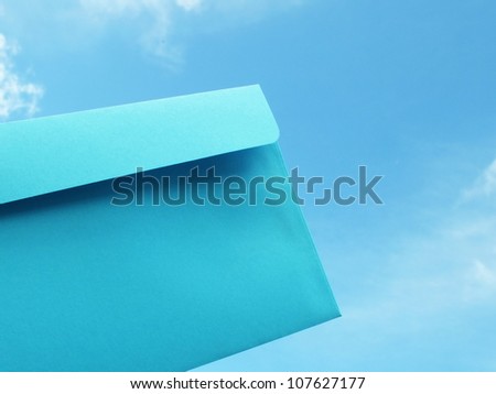 blue card in front of blue sky