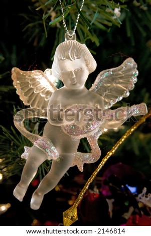 Crystal angel christmas decorations. Golden light.
