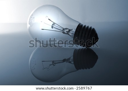 A bulb and its reflection. The bulb is switched on but the reflection is switched off.