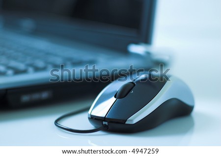 Mouse and laptop - shallow depth of field