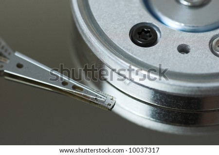 Close-up of hard disk head over a plate