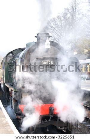 Steam train enveloped in steam at Grosmont (North Yorkshire Moors Railway) station