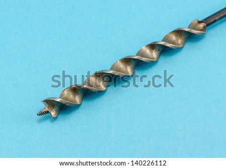 special wood drill bit on blue background.