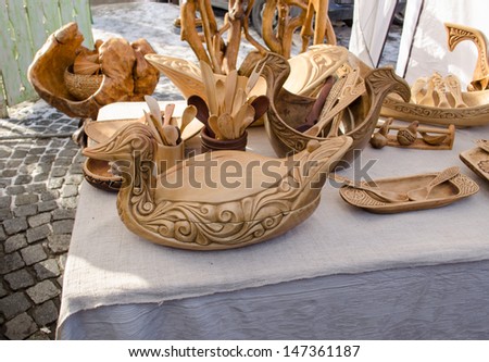 handmade carved diy wooden kitchen tools utensils and bird decorations dish sale in market fair.
