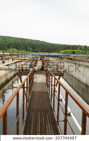 Aeration process of waste sewage water treatment plant. Huge basin with bubbling dirty water. Aerotank grit chamber stage.
