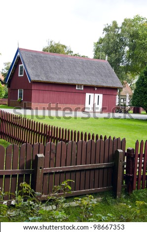 beautiful countryside tourism house fence and tidy lawn environment in yard.